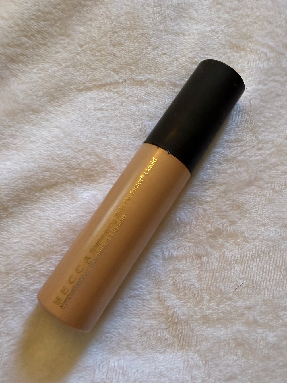 New discontinued Becca shimmering skin perfector liquid in Champagne Pop- viral